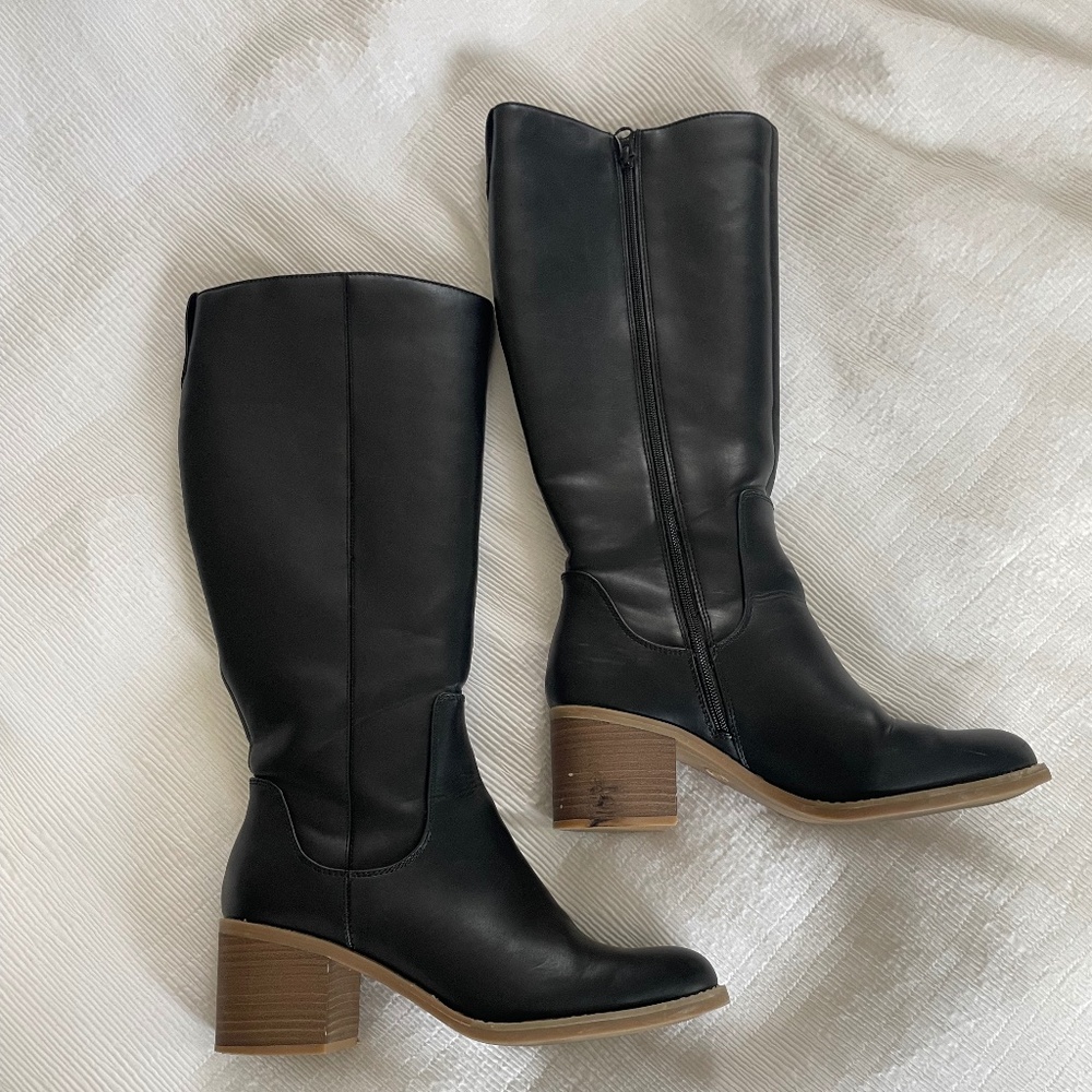 Knee high black heeled boots